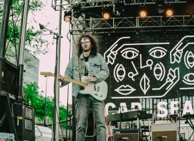 Car Seat Headrest guitarist playing live