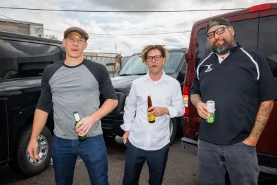 (L–R) Joe DiMeo, Joe Ballato and Jason Martinez smoke in the back lot. DiMeo met Thorpe in a bar in 2001. “We were the two loudest assholes in the bar,” he said. Turns out that they’re both from Pennsylvania, too.