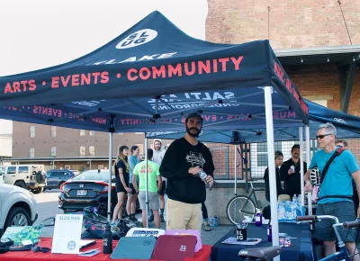 SLUG’s Events Assistant, Nick Zunkowski, hanging out at the merch booth.