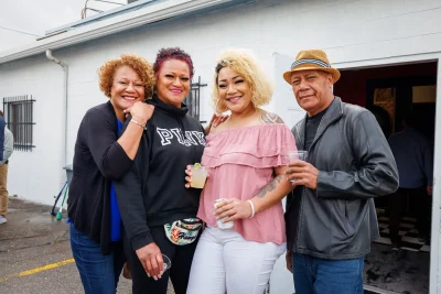 (L–R) Siu Toutai, Lisa Moa, Natalie Toutai and Mana Toutai are ready to hear Natalie recite some poems. Her style ranges from explorations of depression to uplifting poems like “God’s Soldier,” which she’ll perform tonight.