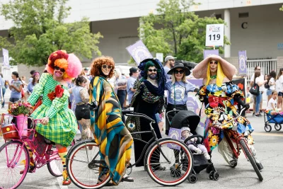 Angela Brown, SLUG Magazine's Executive Editor, posing with new friends getting ready for this year’s parade.