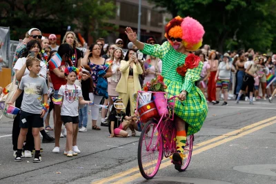 Pride rider telling the crowds that they are loved.