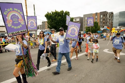 SLUG float friends showing pride and excitement in Salt Lake City's 2022 Pride Parade.