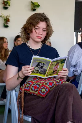 Zion, checking out the playbill of the show.