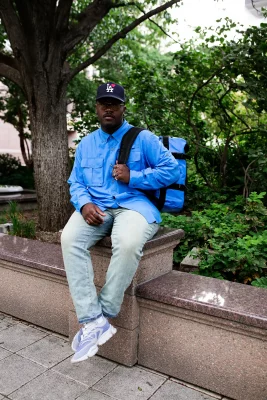 James Ray Davis III sitting on a ledge.