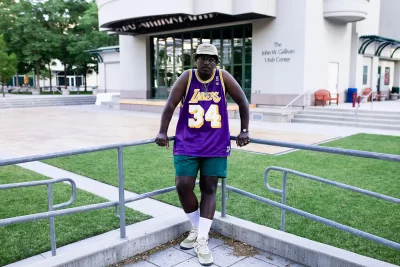 James Ray Davis III standing in the corner of two metal railings.