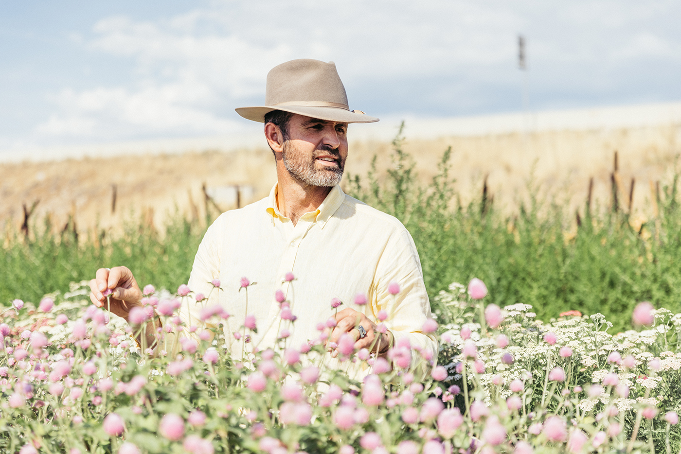 Luke Petersen tends to the vast wildflower fields in The Kinlands, where visitors can create their own bouquets while connecting with nature.