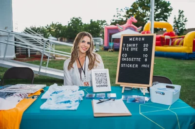 Entertainer Angie Petty with her merch pre-performance at the SLUG Mag Stage. (Photo: @clancycoop)