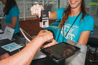 A Craft Lake City DIY Fest attendee gets stamped in by a very friendly volunteer. (Photo: @clancycoop)