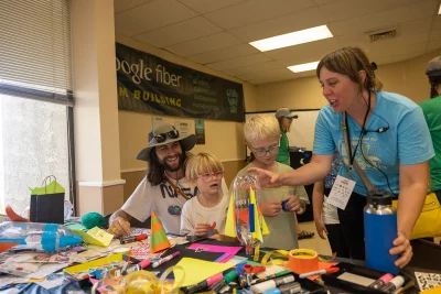 Kids prepare for the water rocket launch in the Google Fiber STEM building.