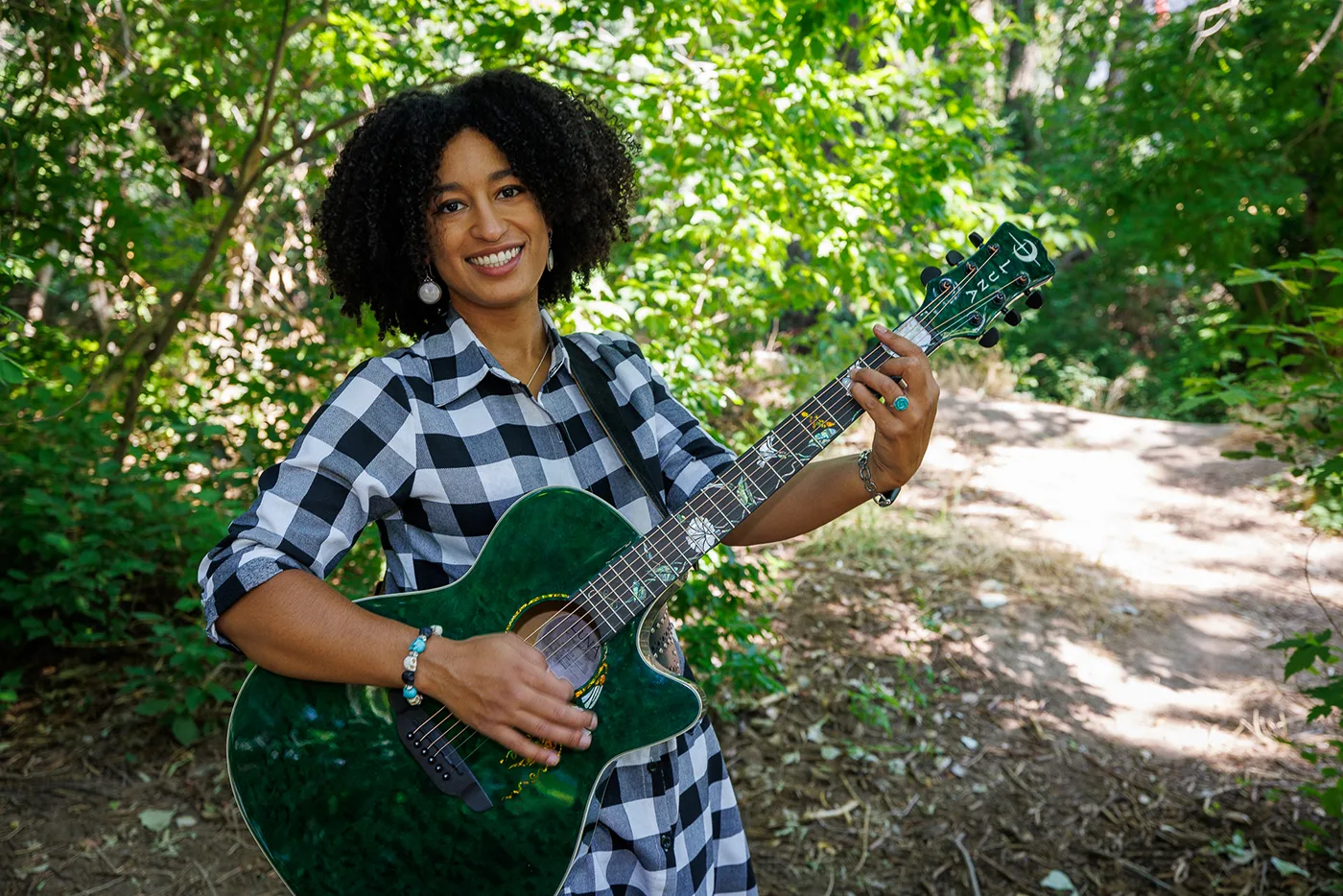 Pepper Rose poses with her guitar