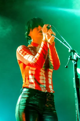 Sharon Van Etten performing live with green stage lighting