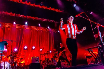 Sharon Van Etten performing with red lighting