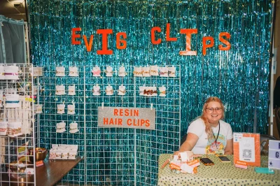 Teresa Romney of EVIG Clips in her shimmering booth showing of resin hairclips of all types. (Photo: @clancycoop)