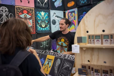 Man selling his t-shirts at the 14th Annual Craft Lake City DIY Fest