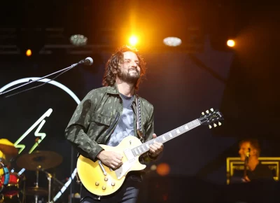 Zack Feinberg playing guitar for The Revivalists playing a sold-out show in SLC. (Photo: LmSorenson.net)