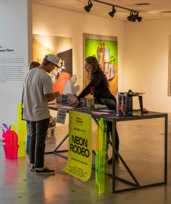 Neon Rodeo check-in station at UMOCA (Photo: Chay Mosqueda)