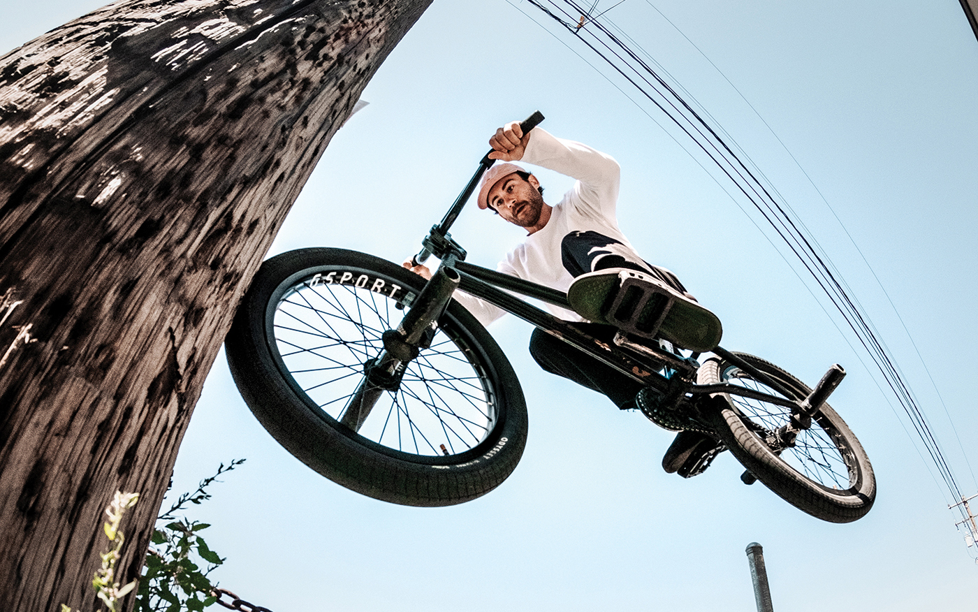 It’s a rarity when photographer and rider switch roles. SLUG photographer John Tinsley 180 nose bonks over the chain for the eye of pro rider Cameron Wood.