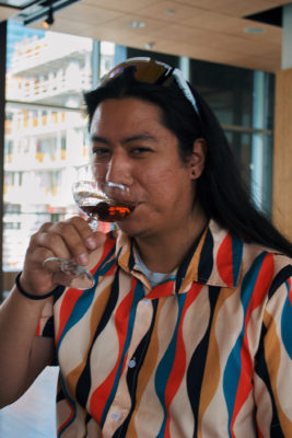 Josh enjoys a sip of the first version of the Manhattan cocktail, made with a rye whiskey and brandied cherry. Photo: Lexi Kiedaisch