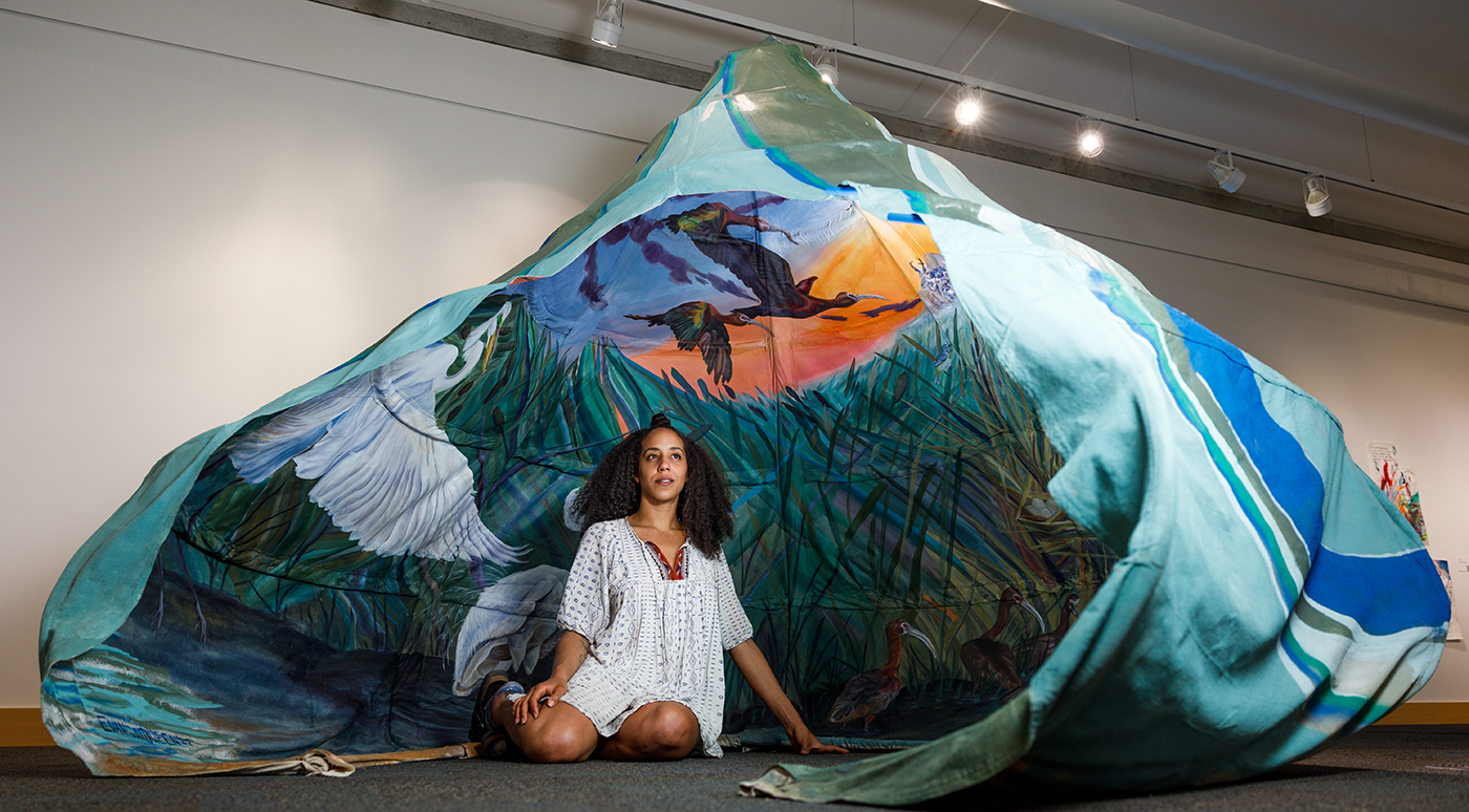 There’s grass, a nod to Evangeline Amadu’s three-dimensional canvas painting of Antelope Island ecology, “What Happens at the Marsh at Dusk.”