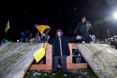 Joey Fava, last years snowboarding champion, lending out a hand during the contest. (Photo: Jovvany Villalobos)