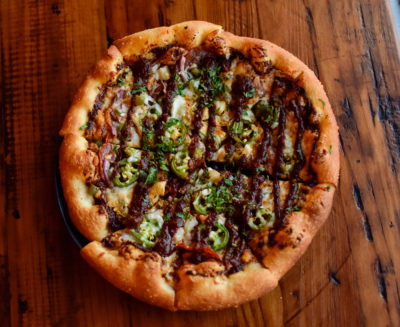Tastes Like Burning pizza with jalapenos, roasted chipotles and Slackwater’s spicy marinara sauce.