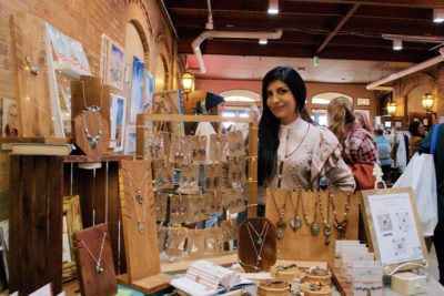 Another shot of Cynthia at her jewelry booth.