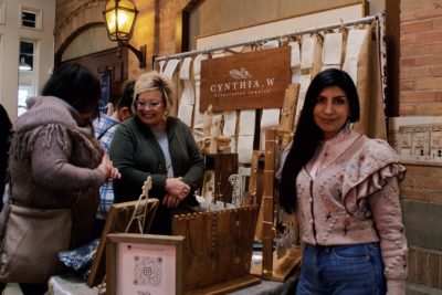 Cynthia Wainscott of Cynthia W. Jewelry proudly stands in front of her beautiful booth.