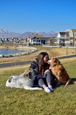 Taylor Munson of Proper Paws Dog Training gets a smooch from a sweet golden