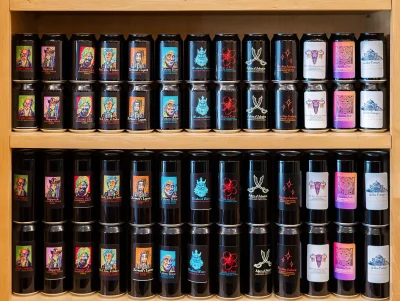 Columns of the Six Sailor ciders are arranged on shelves. Photo: Ashley Christenson