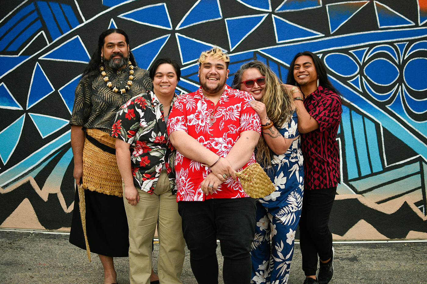 Members of the Nuanua Collective leadership team (L–R Ma’afu Suliafu, Anita Uhi, Jakey Sala Siolo, Angela Robinson and Isaiah Asiata) stand in front of Midvale artist Kalani Tonga’s mural.