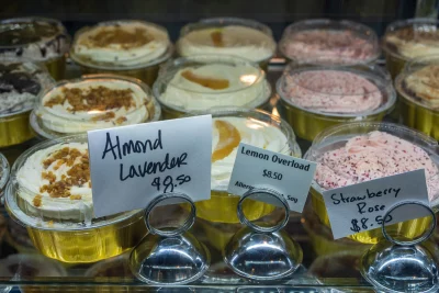 A selection of Almond Lavender, Lemon Overload and Strawberry Rose treats behind the counter at Sweet Hazel and Co.