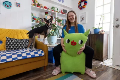 Barney and her dog at her home studio. 