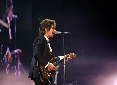 Alex Turner performing with the Arctic Monkeys at the Delta Center