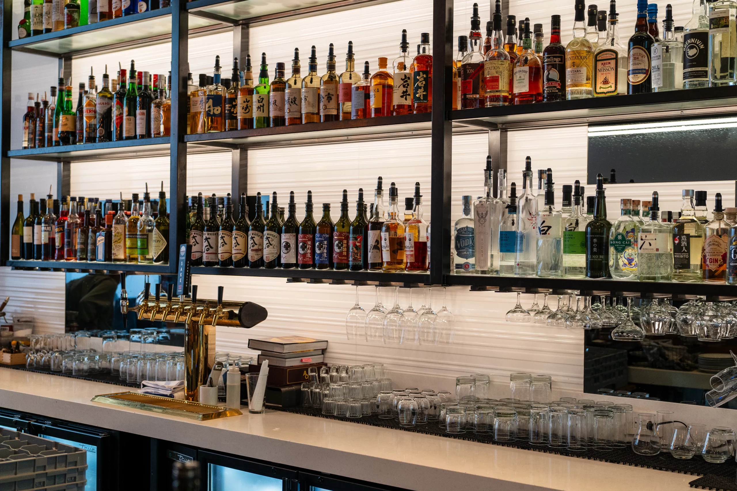 Bottles of whisky lining the shelves behind the bar at Post Office Place.