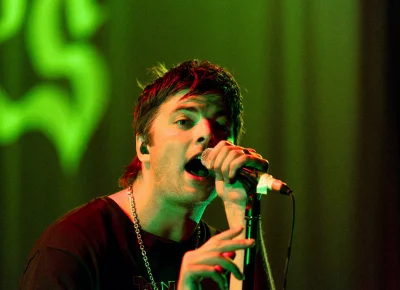 Lead singer for Fontaines D.C. making eye contact with the front row.