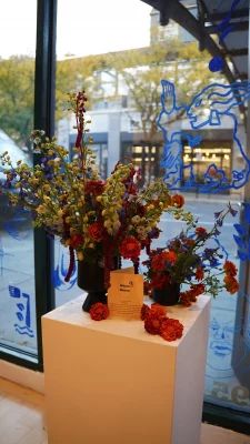 A white pedestal covered with flowers.