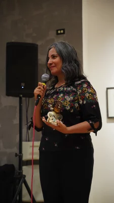 Winner of Ruby Chacon with a microphone in their hand.