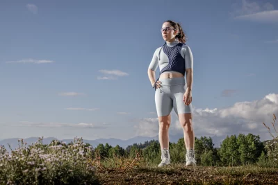 A model stands with a hand on their hip, wearing Brennah's Intrepid collection.