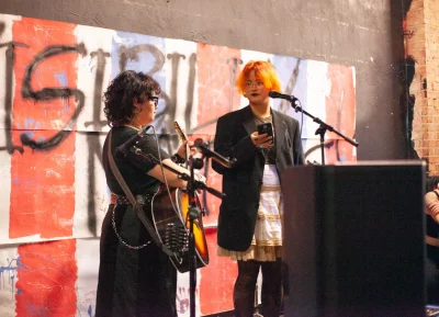 Performers side stage during open mic. Photo: Abel Cayas