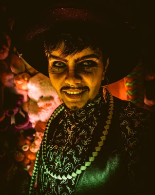 Heller Highwater grins in dim lighting