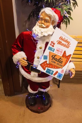 A Santa animatronic in the Indie Game Arcade.