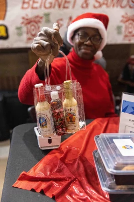 Cathy Tshilombo-Lokemba of Mama Africa displays her hot sauce