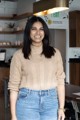 Lavanya Mahate looks into the camera smiling.