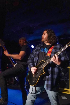 Mike plays on stage with his band, Absolved.