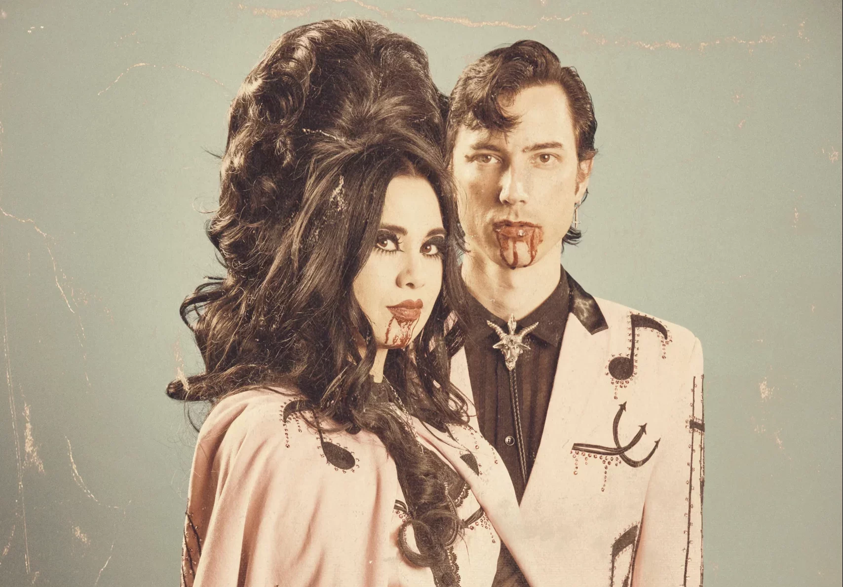 Twin Temple wear matching pink outfits.