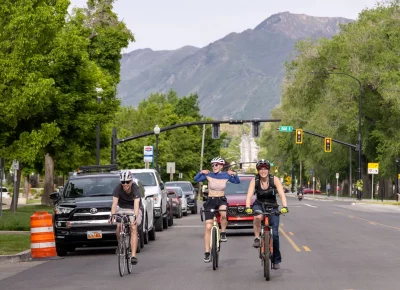 (L-R) Jacob, Danielle and Karrie ride down 900 South during the 12th Annual SLUG Cat. Danielle was always that kid shouting, “Look ma, no hands!” Photo: TaCara DeTevis.