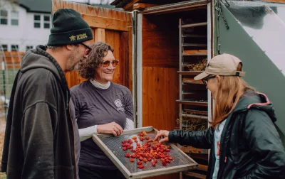 People gather around radishes.