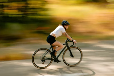 Action shot of a rider on biclycle moving quickly on a trail.