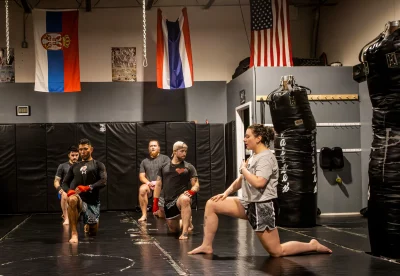 Alexis Whitney guides students through stretching.